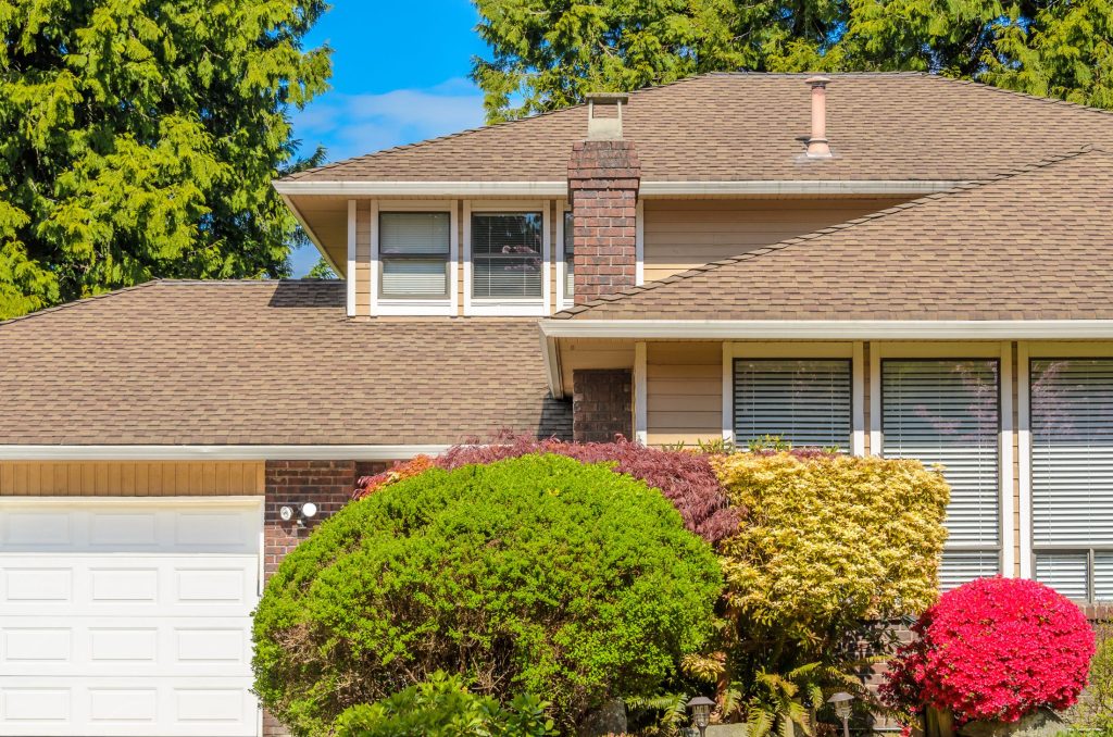 A home in Franklin Park with a brick chimney