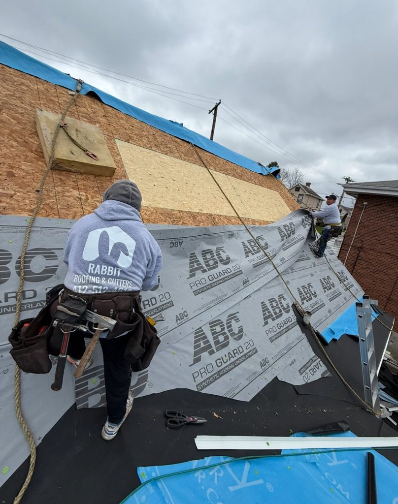 Rabbit roofing contractor doing a roof layer